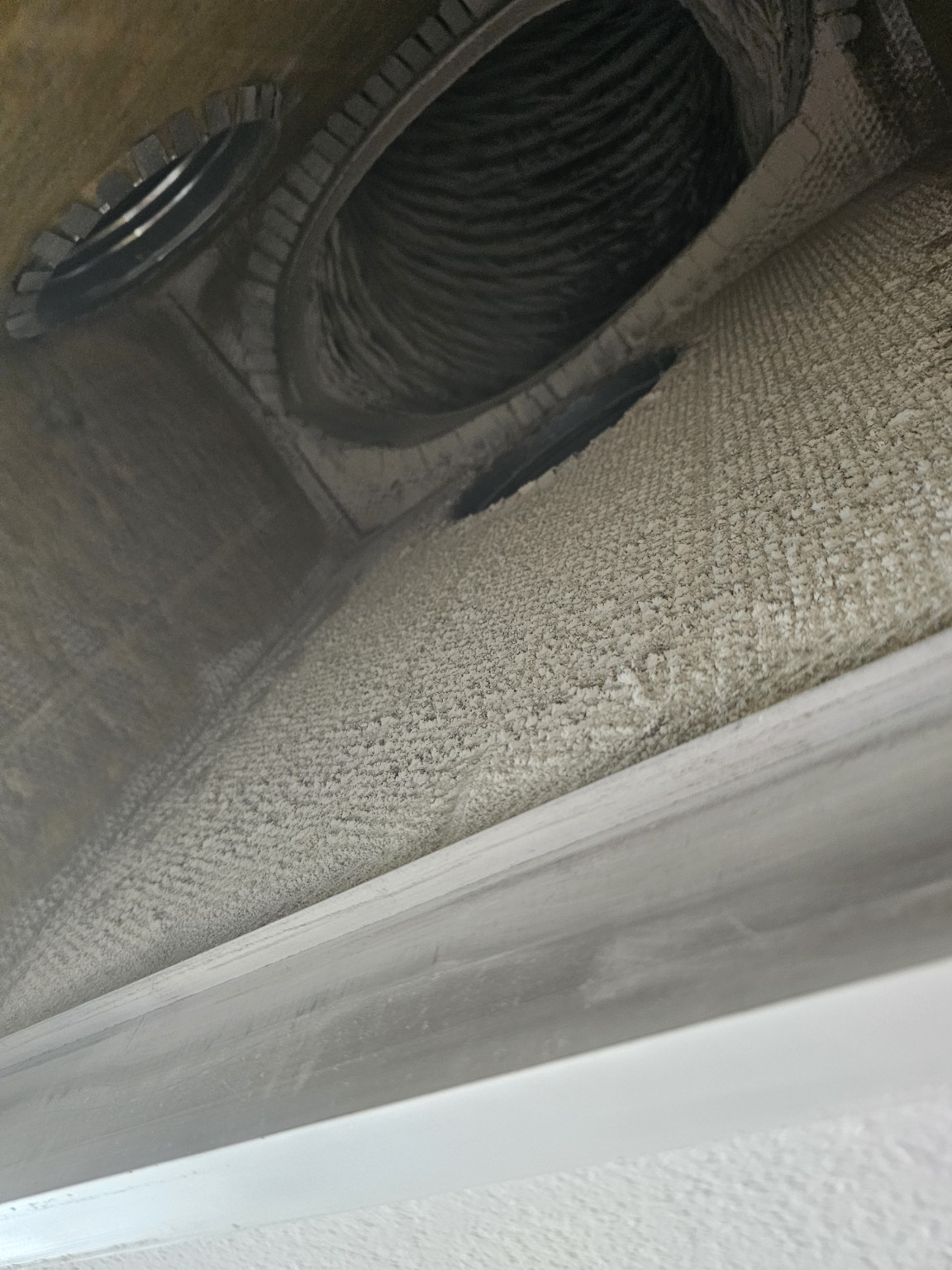 Dust buildup inside ductwork before cleaning